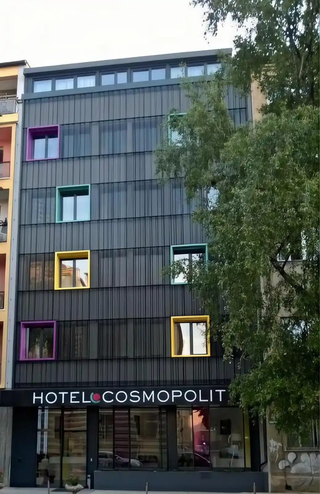 Hotel Cosmopolit facade with colorful window frames on Radićeva Street